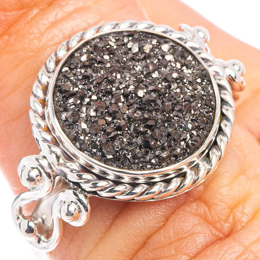 Oval black drusy ring in silver with ornate bezel and decorative band