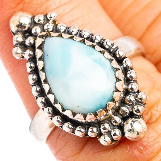 Close-up: oval larimar cabochon ring in .925 sterling silver with bezel beads