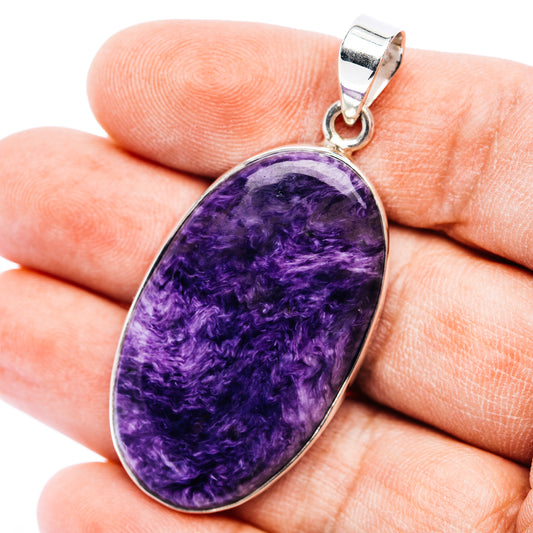 Oval charoite pendant in .925 sterling silver with purple stone