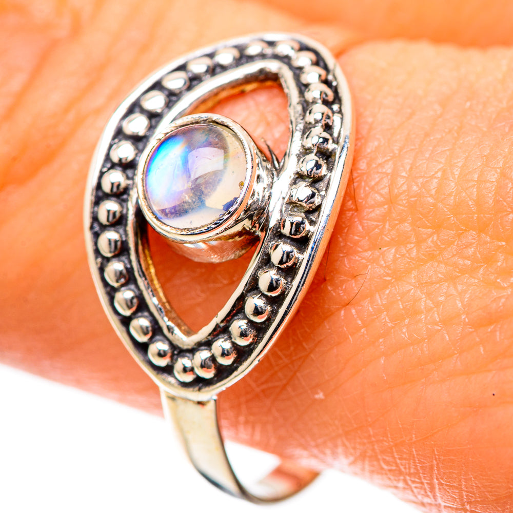 Sterling silver ring with oval rainbow moonstone cabochon and beaded oval frame