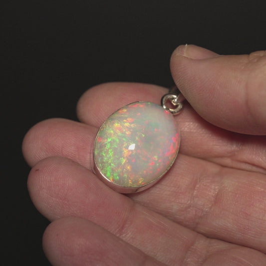 20.05ct Ethiopian Opal Pendant 1 1/2" (.925 Sterling Silver)