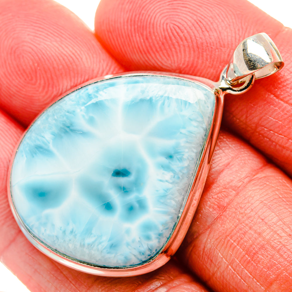 Teardrop larimar pendant in sterling silver with light blue stone and loop bail