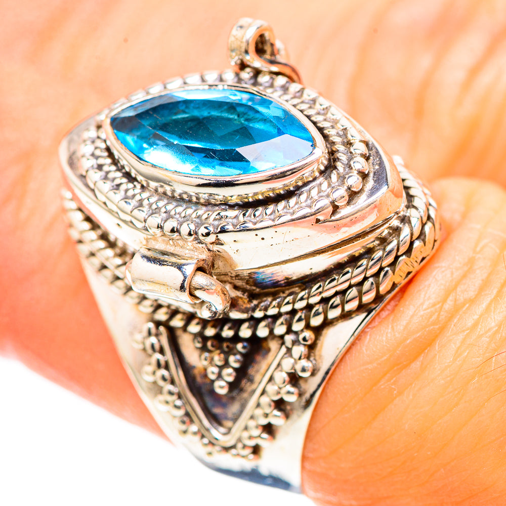Sterling silver ring with oval blue gemstone and ornate bezel, size 6.75