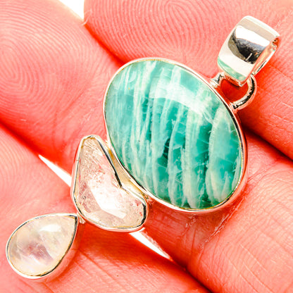 Silver bezel amazonite pendant with oval green cabochon and opalescent drop accents