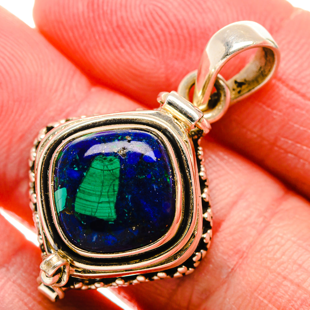Sterling silver pendant with oval blue cabochon and green veining in layered bezel
