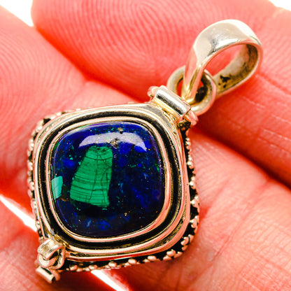 Sterling silver pendant with oval blue cabochon and green veining in layered bezel