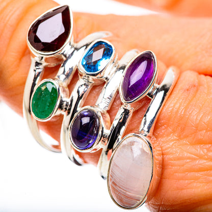 Sterling silver gemstone ring close-up with red, green, blue, purple, and iridescent moonstone