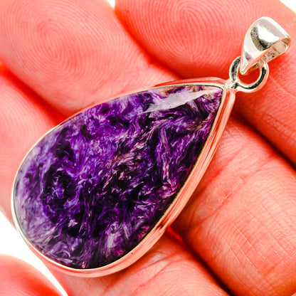 Charoite pendant with teardrop purple stone bezel and silver bail on bail top
