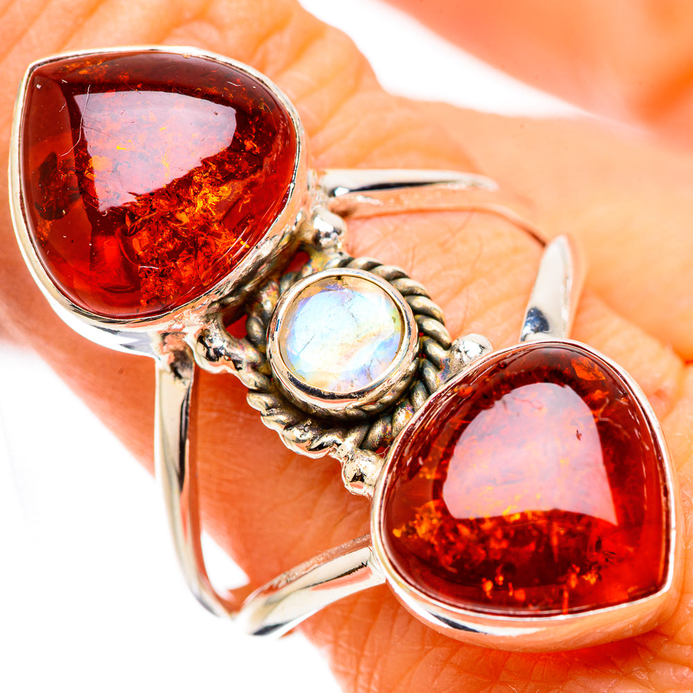 Silver ring with two large amber teardrop stones and a round moonstone accent