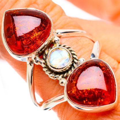 Silver ring with two large amber teardrop stones and a round moonstone accent