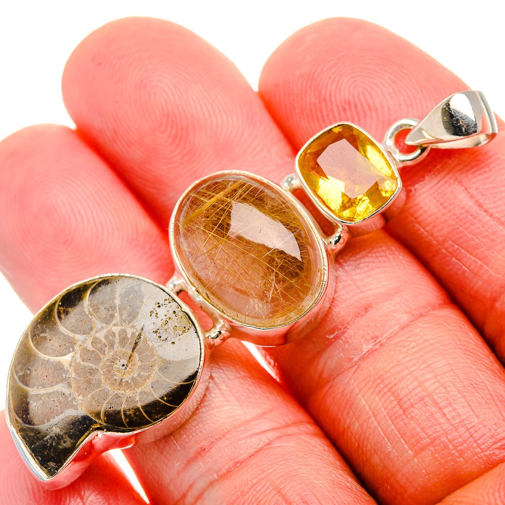 Ammonite fossil, rutilated quartz & citrine sterling silver pendant on hand