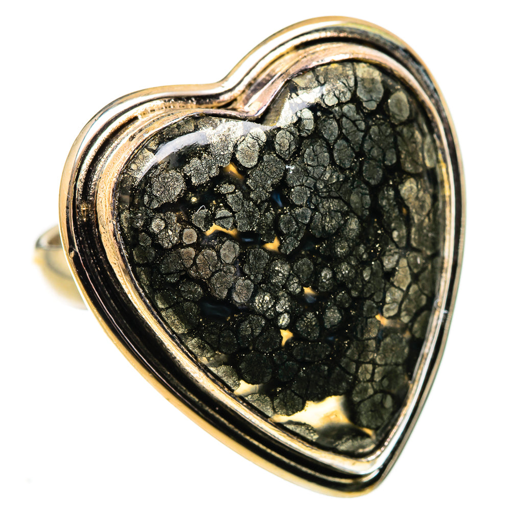 Heart-shaped black gemstone ring with gold flecks, openwork metal border on band
