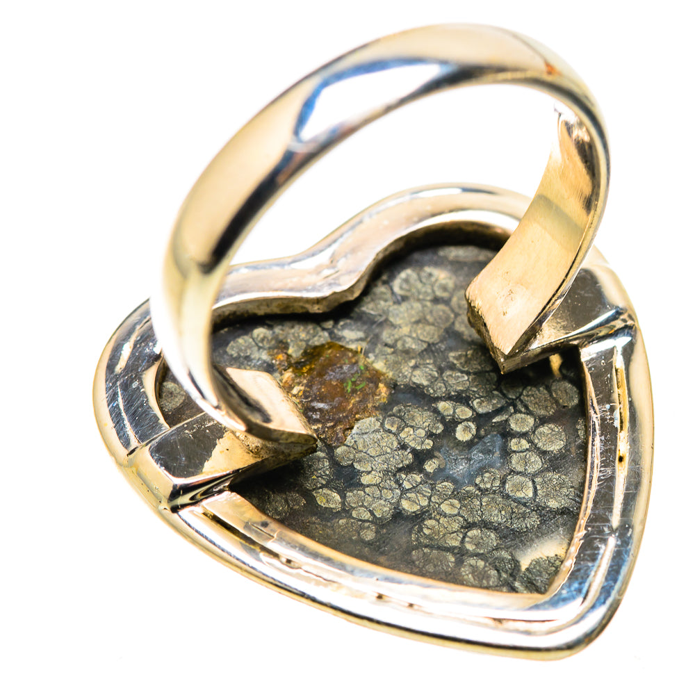 Heart-shaped black gemstone ring with gold-speckled face and curved silver setting