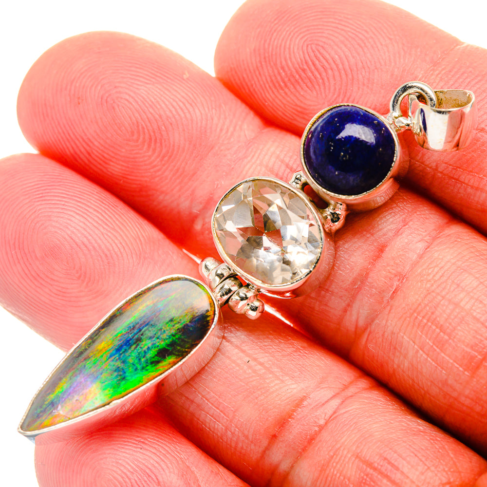 Sterling silver pendant: lapis round, clear quartz, and iridescent opal leaf