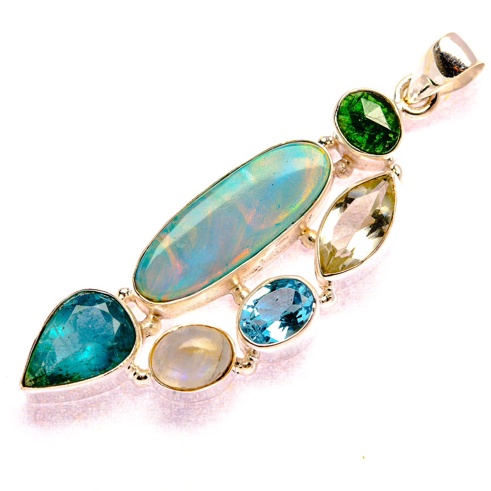 Gemstone silver pendant with large oval opal-like stone, green, blue, and clear drops