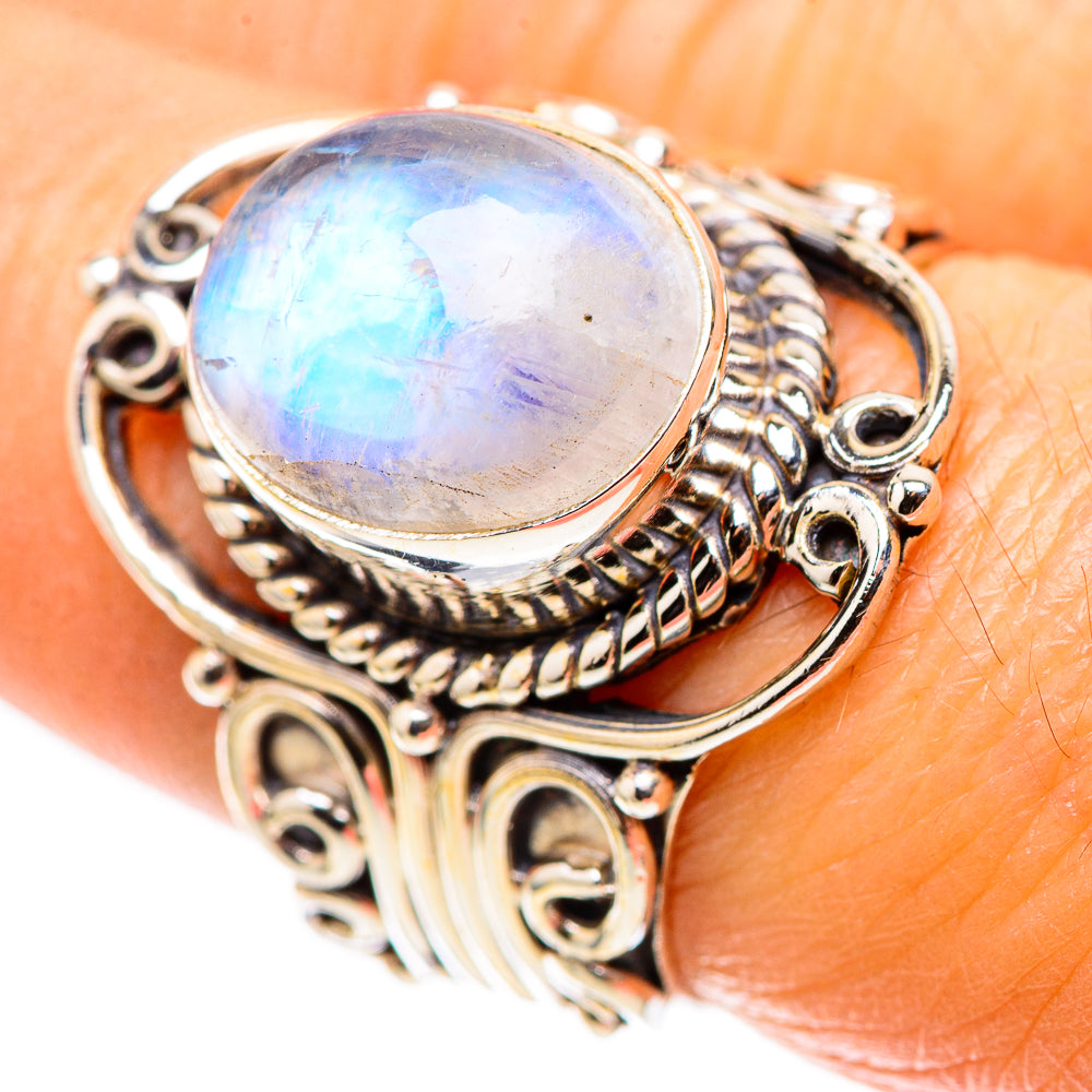 Sterling silver ring with oval rainbow moonstone and ornate filigree bezel