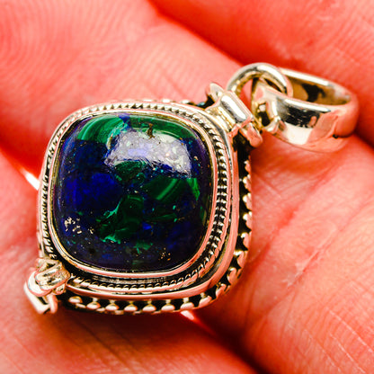 Round sterling silver pendant with blue-green azurite stone, ornate bezel and bail