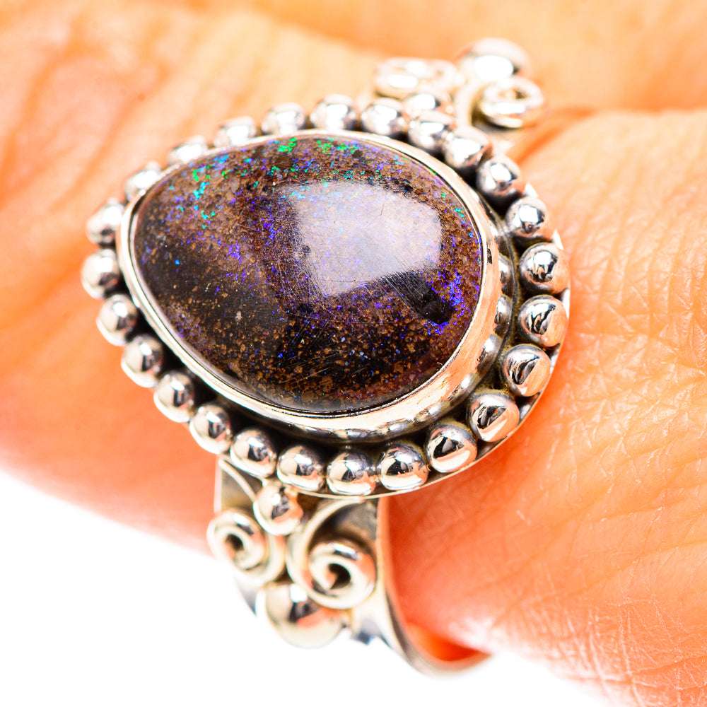 Sterling silver ring with oval opal cabochon, purple-green shimmer, beaded border