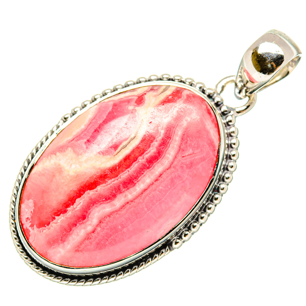 Large oval rhodochrosite pendant with hinged bail, silver rope-edge frame