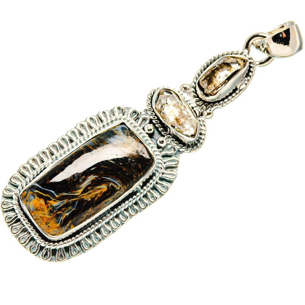 Sterling silver pendant featuring rectangular pietersite cabochon and clear prong-set stone