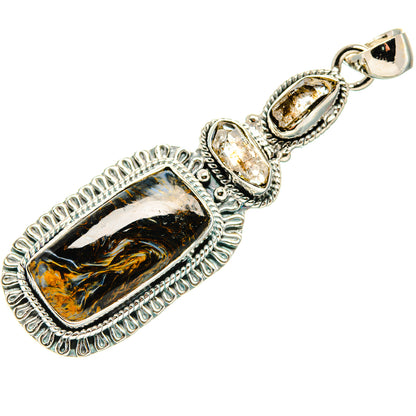 Sterling silver pendant featuring rectangular pietersite cabochon and clear prong-set stone