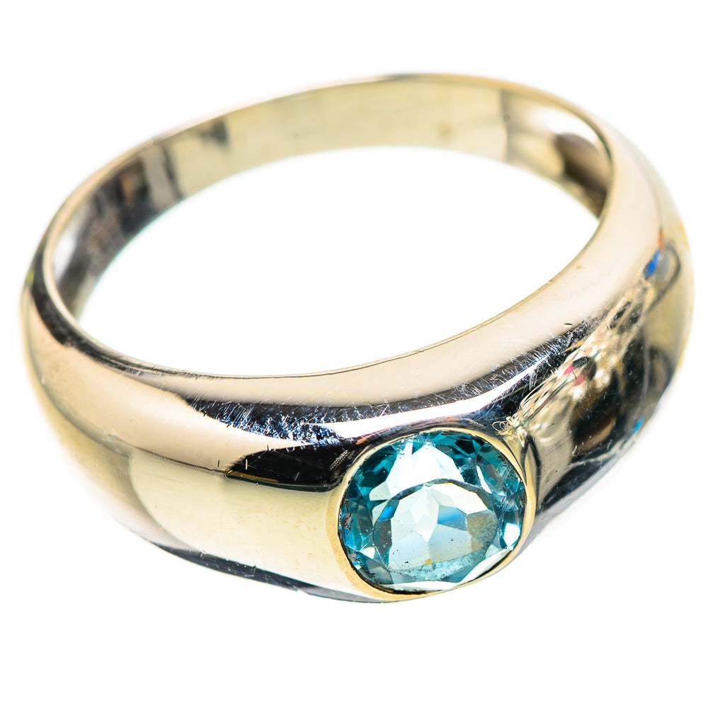 Sterling silver ring with blue oval gemstone on the band, polished reflective finish