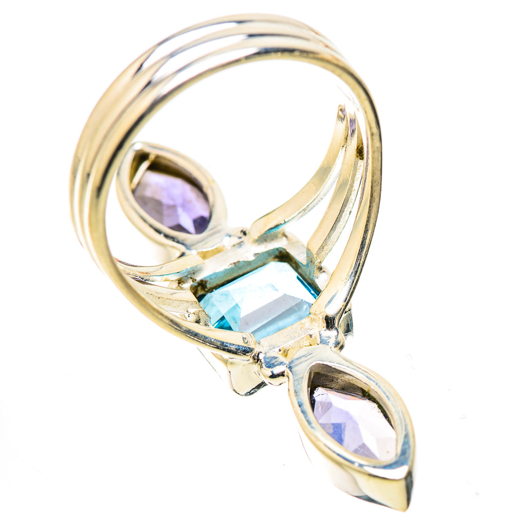 Silver-tone ring with square blue gemstone center and two marquise purple side stones