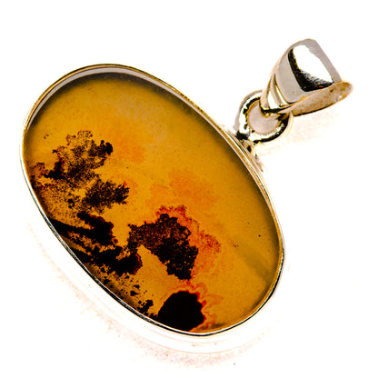 Oval sterling silver pendant with warm yellow-orange agate cabochon and black dendrites