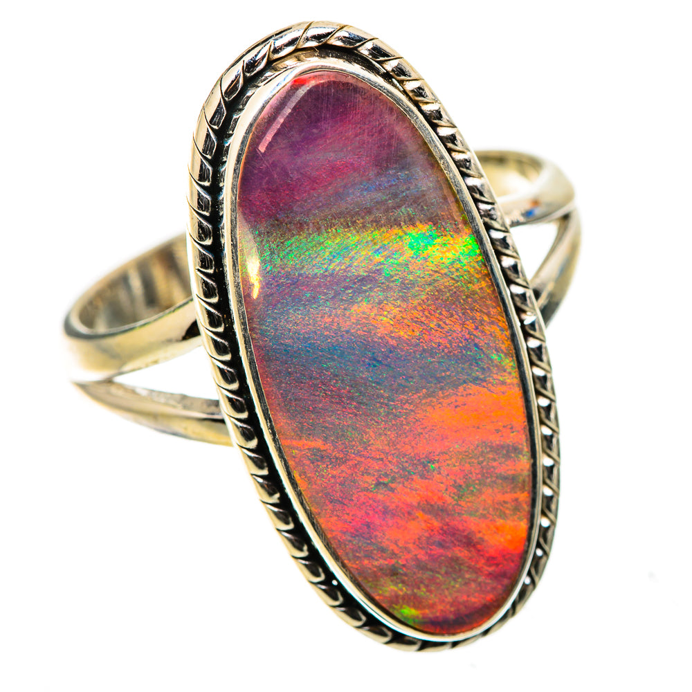 Iridescent oval opal ring with ornate sterling silver border, size 10