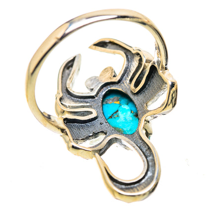 Two-tone gold and silver ring with turquoise cabochon in ornate claw setting