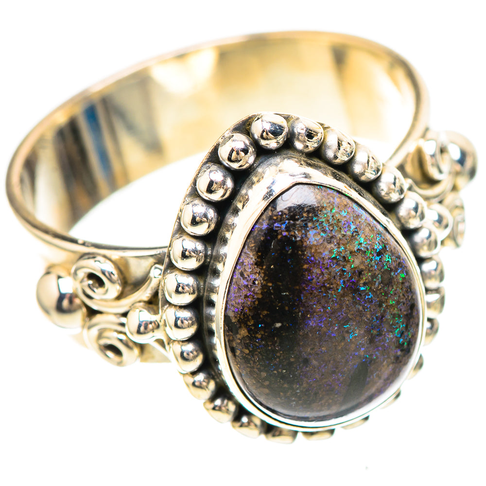 Sterling silver ring with oval opal cabochon and beaded halo, ornate scroll band