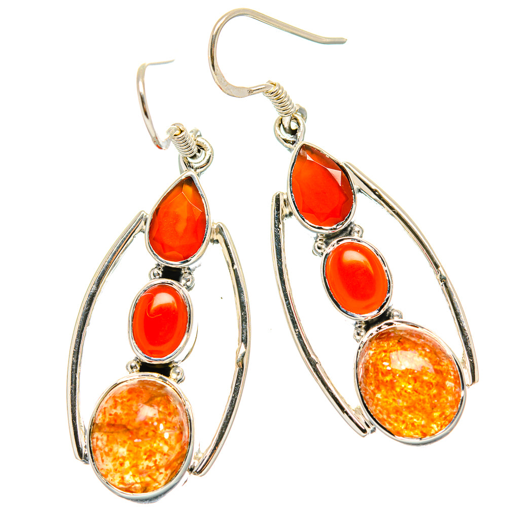 Red onyx teardrop earrings with oval silver frames and orange amber glitter stones
