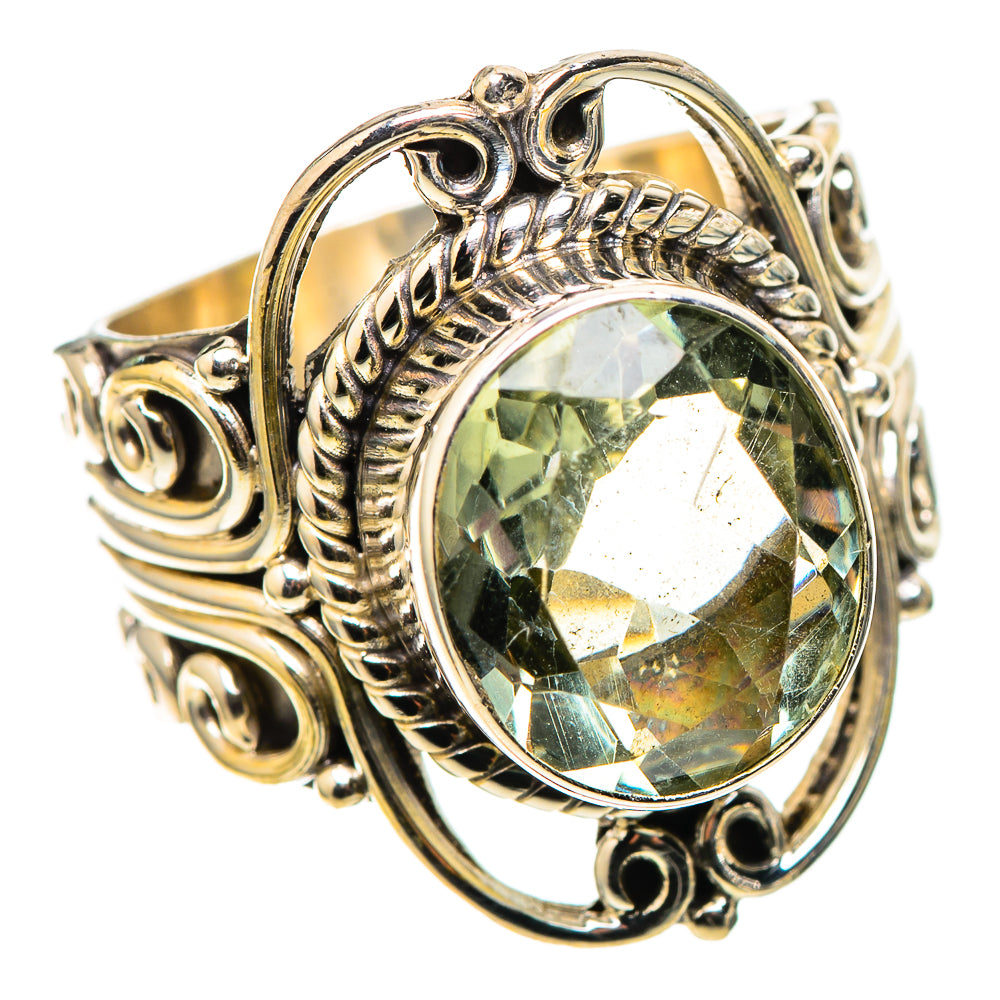 Sterling silver ring with large oval faceted green amethyst and detailed side scrollwork