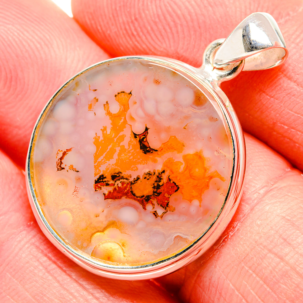 Dendritic agate pendant in sterling silver, round pink-orange stone with dark dendrites