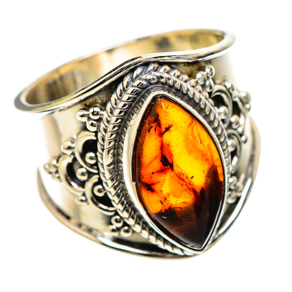 Sterling silver ring with teardrop amber cabochon and detailed filigree border
