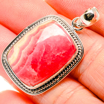 Rhodochrosite pendant with pink-red gemstone in ornate 925 sterling silver bezel