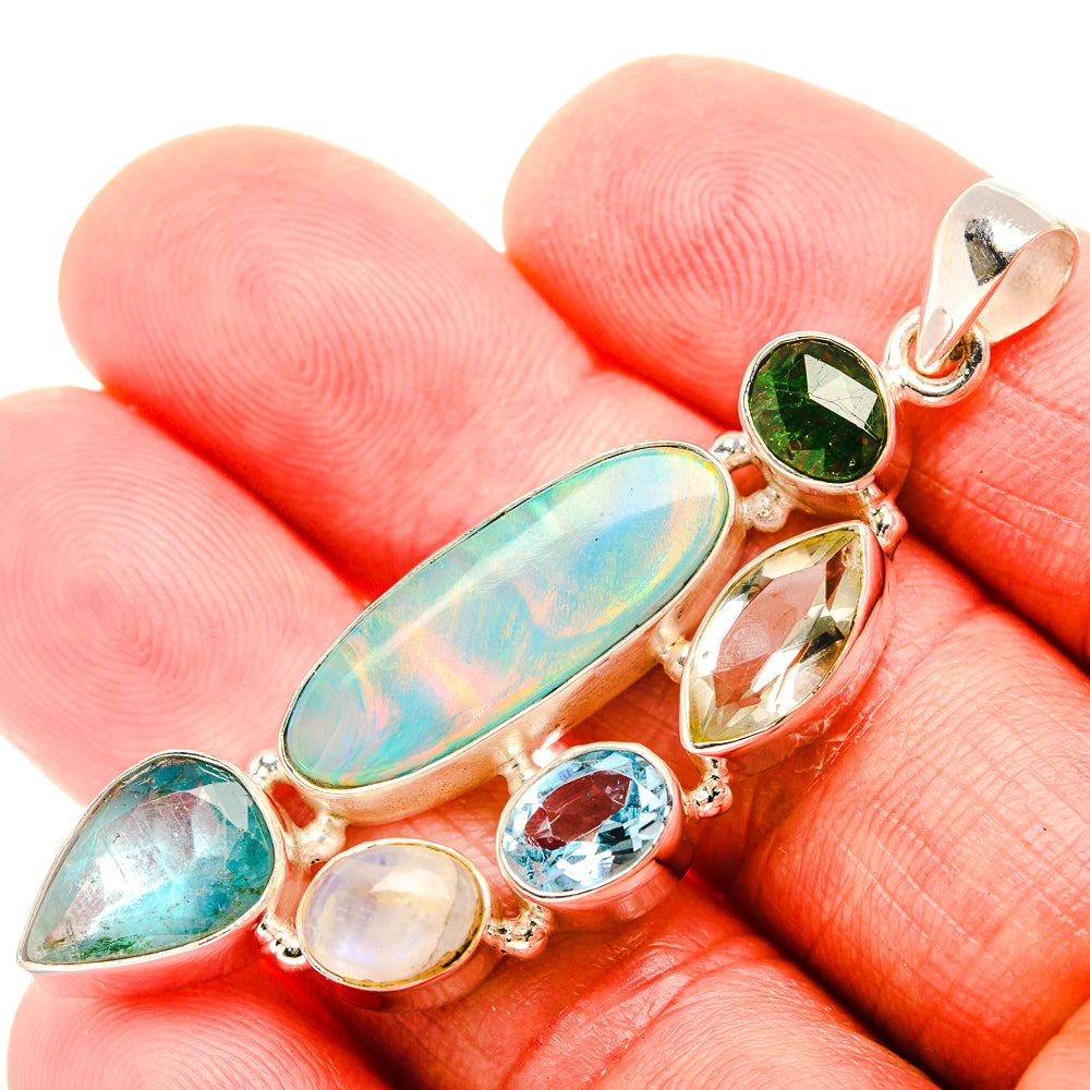 Gemstone silver pendant with oval opal-like center, green and blue teardrop accents