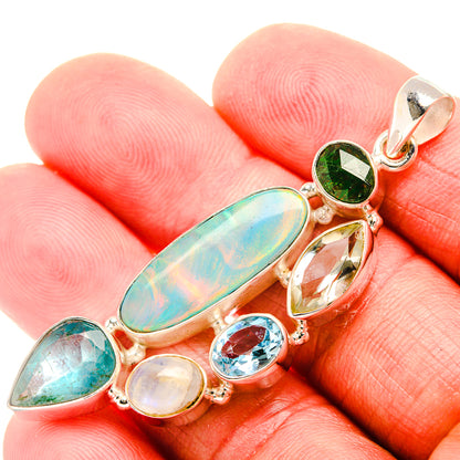 Gemstone silver pendant with oval opal-like center, green and blue teardrop accents