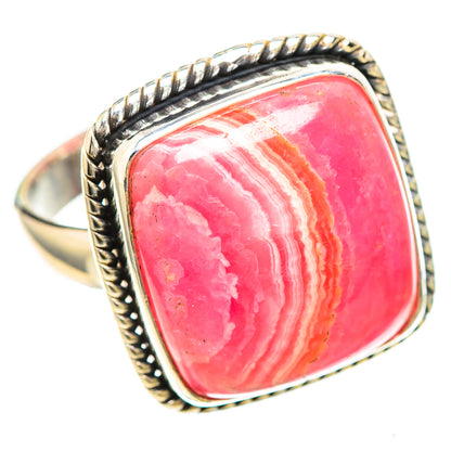 Sterling silver ring featuring a pink rhodochrosite oval cabochon with white stripes, braided edge