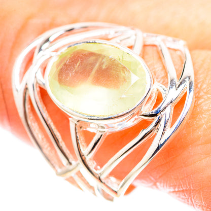 Sterling silver ring with oval prehnite cabochon and swirling openwork setting