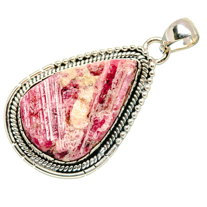 Oval rough red/pink gemstone pendant with sterling silver beaded border and bail