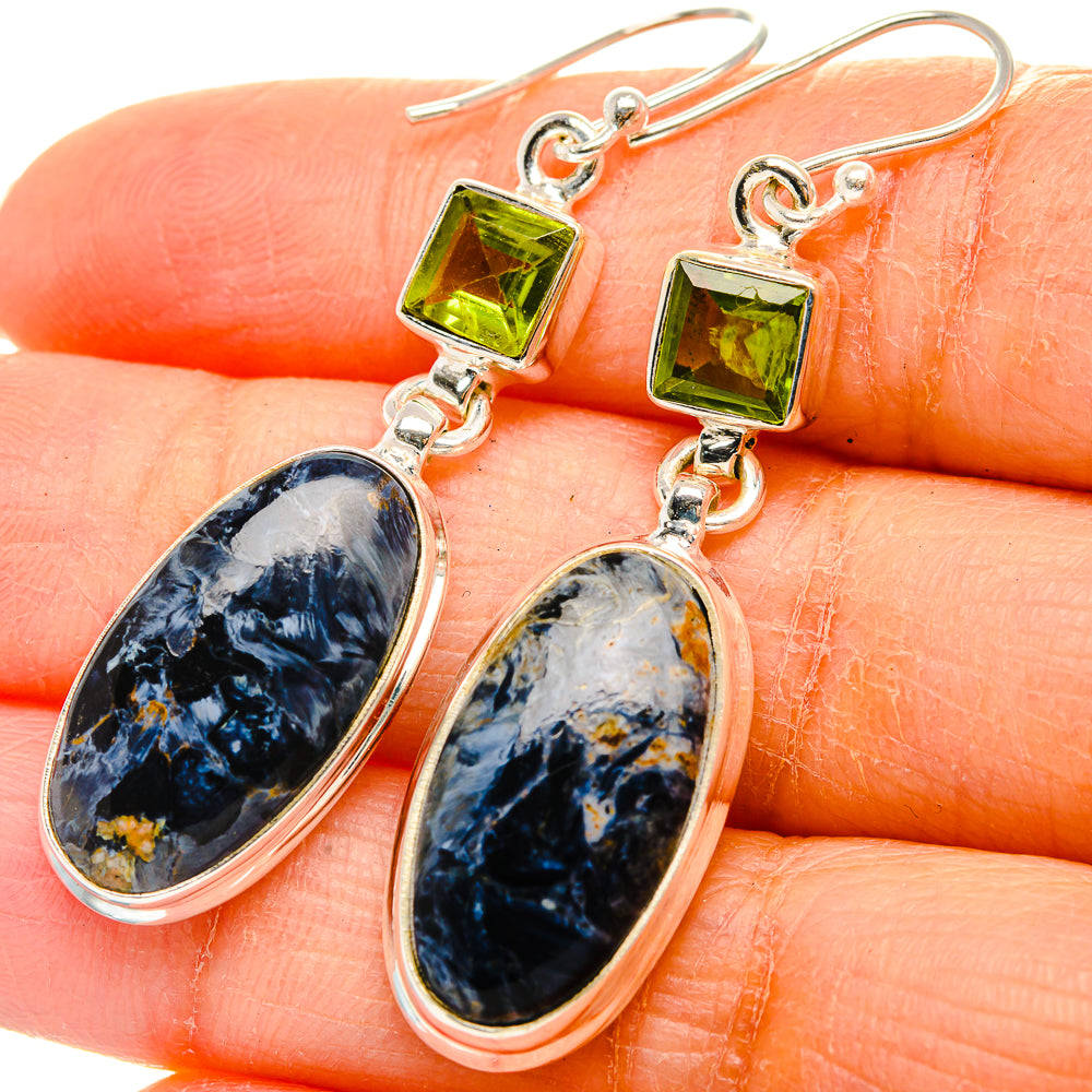 Sterling silver drop earrings with green peridot square and blue pietersite oval stones.