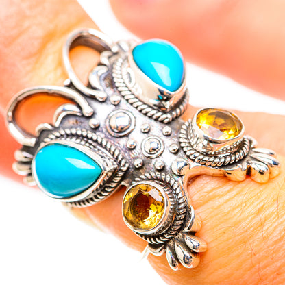 Turquoise and citrine sterling silver ring on finger, ornate scalloped bezel