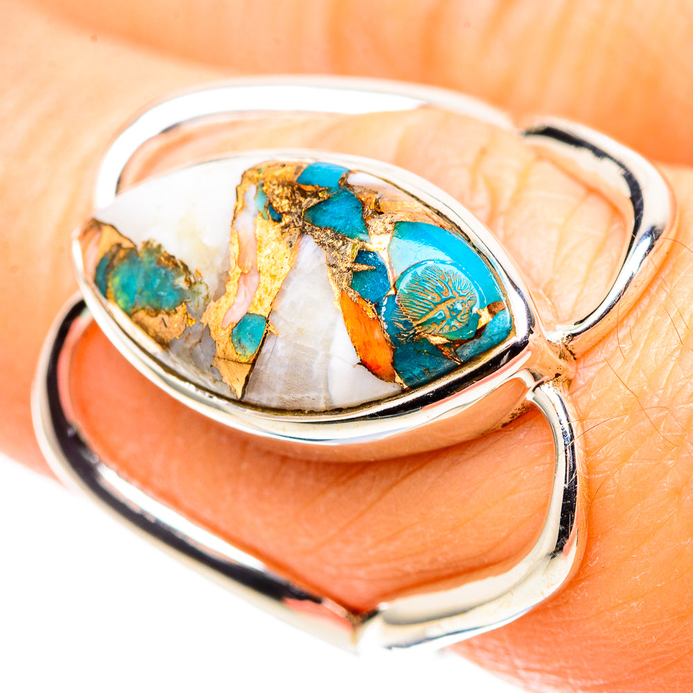 Sterling silver ring with oval turquoise inlay and gold matrix on white shell