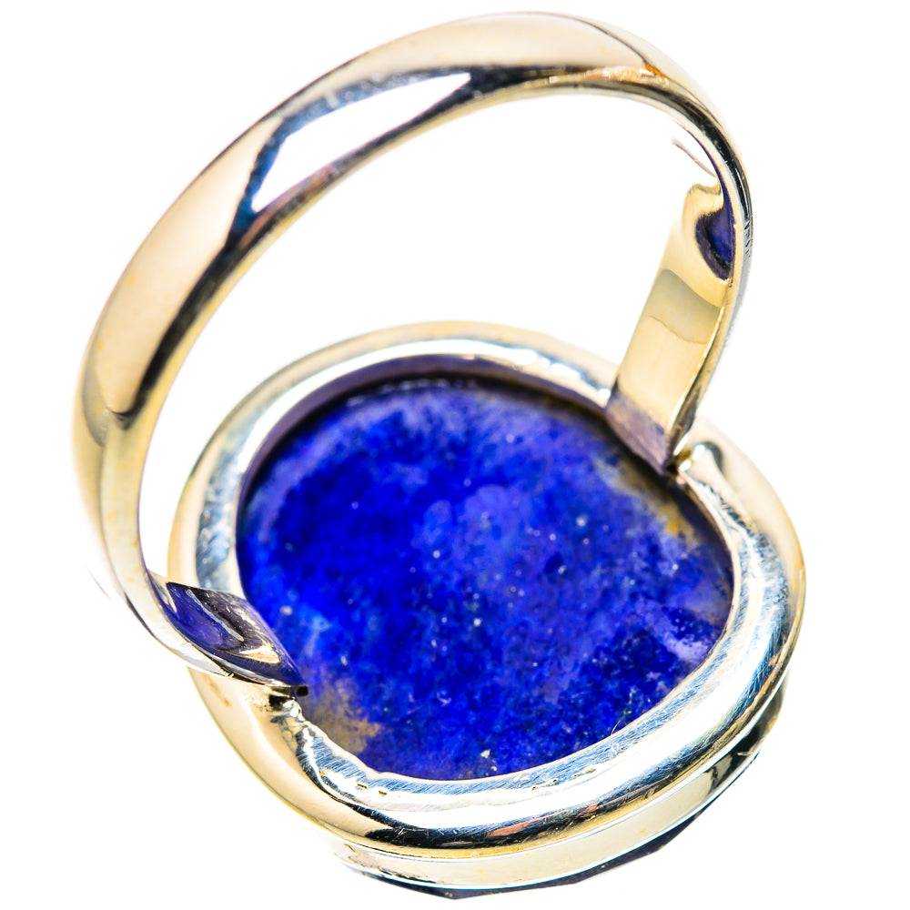 Sterling silver lapis lazuli ring viewed from side, oval blue cabochon in open bezel