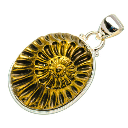 Round pyrite fossil pendant with gold spiral pattern, polished silver frame and bail