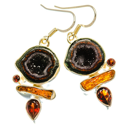 Dangle earrings with black druzy geode ovals, amber-orange stone accents, gold-tone settings