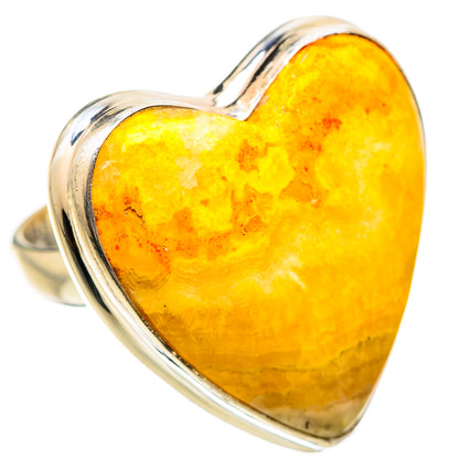 Sterling silver ring featuring a heart-shaped yellow mookaite cabochon stone setting
