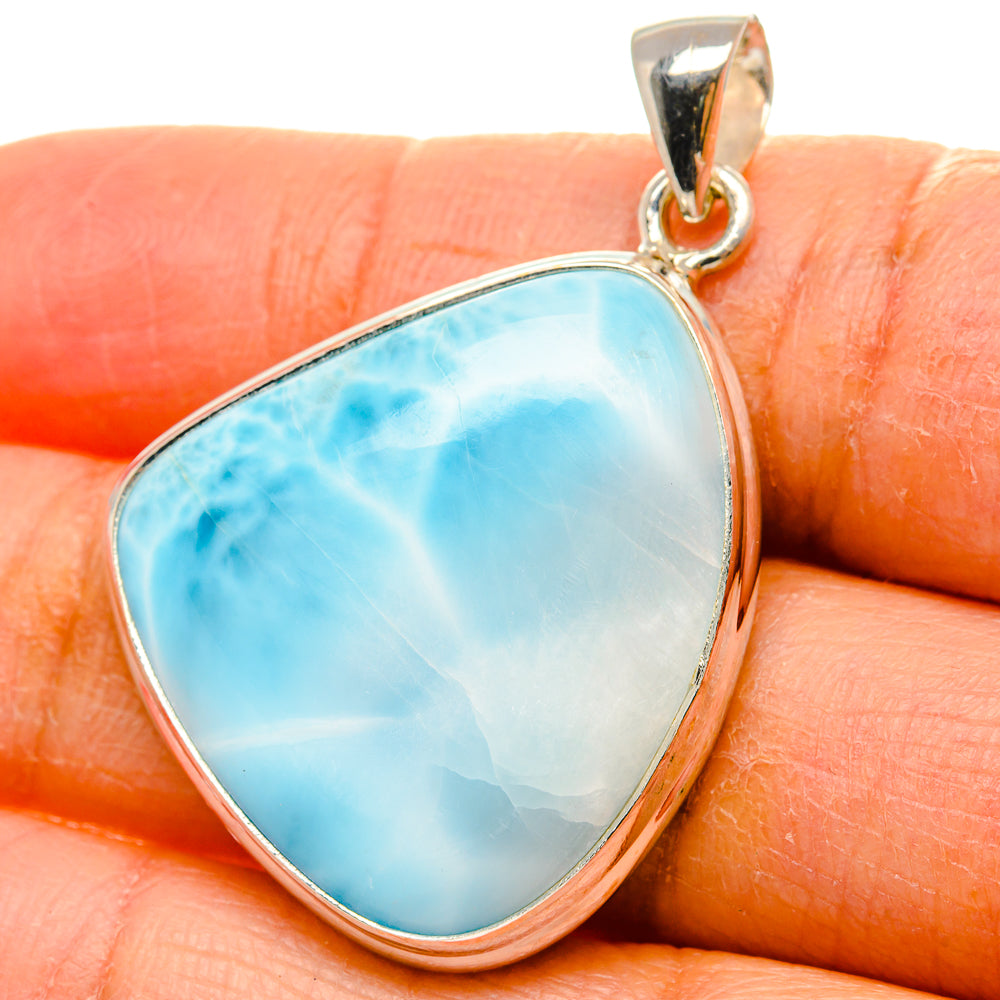 925 sterling silver larimar pendant, teardrop blue stone on finger for scale