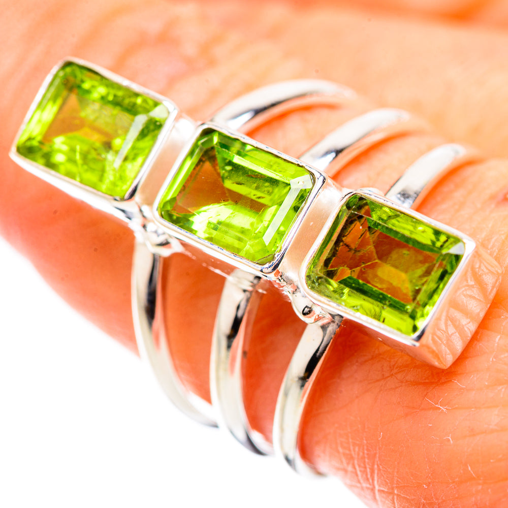 Sterling silver ring with three square green peridot stones in prong settings